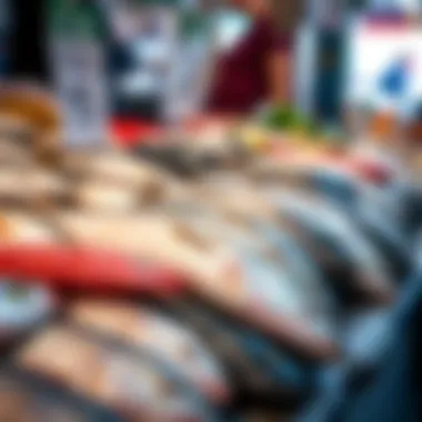 Fresh Fish Varieties A variety of fish displayed on a market stall showcasing their freshness.