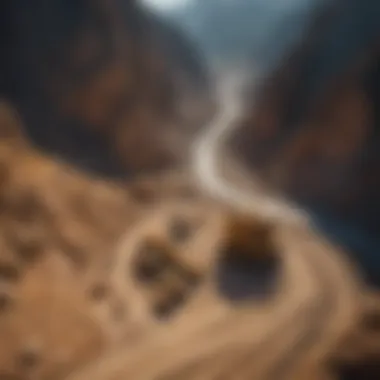 Aerial view of a large gold mine surrounded by mountains